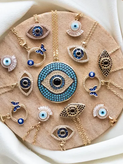 An overview of my evil eye necklace collection. From the classic round lash design to the modern butterfly charm, there's a protective piece for every style.