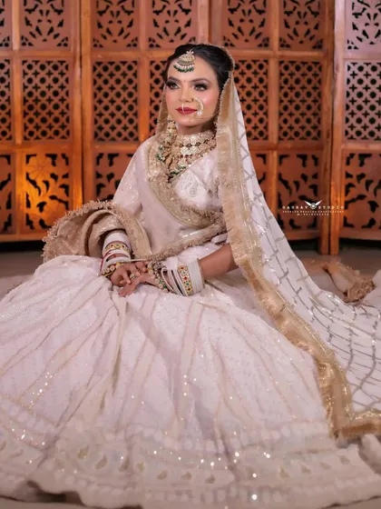 A full seated portrait from a straight-on angle, highlighting the symmetry and beauty of the entire look.