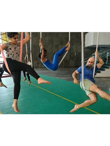 A dynamic shot of our Vayu Yoga class in session, with students and our instructor moving together, each at their own pace.