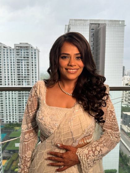 Her smile says it all! This unfiltered photo shows how the makeup looks fresh and natural, enhancing her features perfectly.