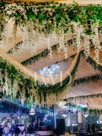 Another view of the spectacular floral ceiling, showing the scale of the installation. We aim to create immersive environments that transport your guests.