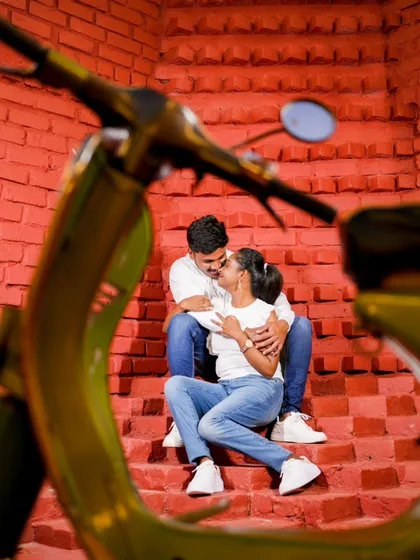 A creative shot of the couple through the handlebars of a scooter. We are always looking for unique angles to make your photos stand out.