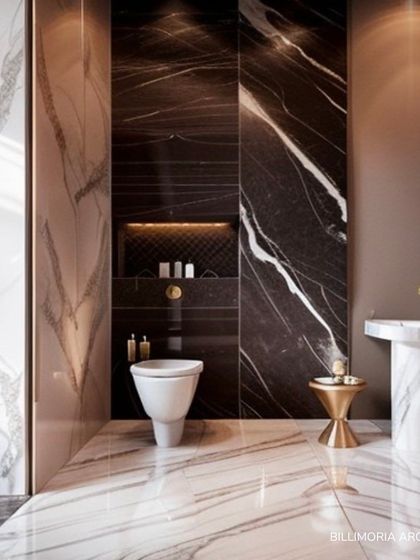 This powder room makes a bold statement with floor-to-ceiling dark marble. A minimalist pedestal sink and gold accents provide a striking contrast, creating a space that is both dramatic and elegant.