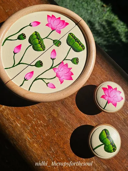 I love how these hand-painted furniture handles turned out. The Pichwai-inspired lotus design adds a pop of bright pink and green, completely transforming a simple TV unit with a touch of traditional Indian art.