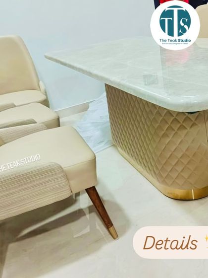 A close-up look at the details of this custom dining set. You can see the fine quilting on the upholstered table base, the smooth finish of the marble, and the combination of textures on the two-toned dining chairs.