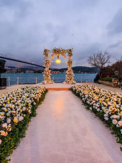 A beautiful floral arch set against the Bosphorus Strait in Istanbul. This vow renewal ceremony setup proves that even the most stunning natural backdrops can be enhanced with elegant design.