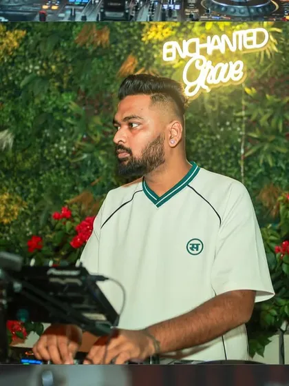 A profile shot of me at the decks. The focus is always on delivering a seamless musical experience.