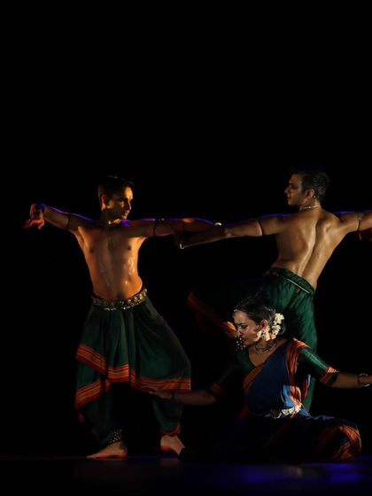 A group formation from 'Nagamandala', showing how dancers can be positioned to create a single, cohesive visual line.
