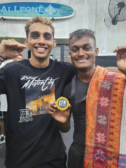 Celebrating a gold medal win in Bali with a teammate. The bonds forged through struggle and victory are unbreakable.
