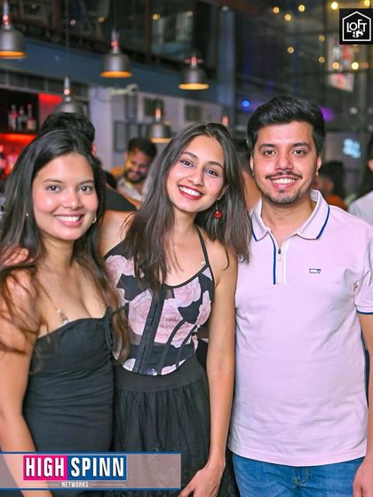 A happy trio of friends enjoying a Sunday night out.