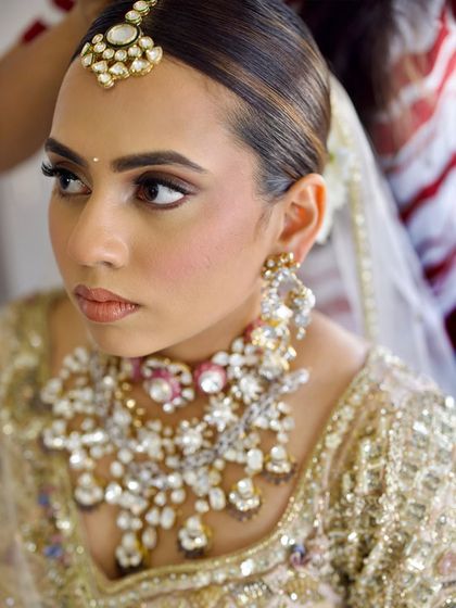 This close-up shows the clean lines and flawless base required for a sophisticated bridal look. I emphasize precision and attention to detail in my training.