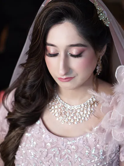 Aaliyah's engagement look, captured with her eyes gently closed to showcase the delicate pink shimmer. This is the epitome of soft, romantic glam.