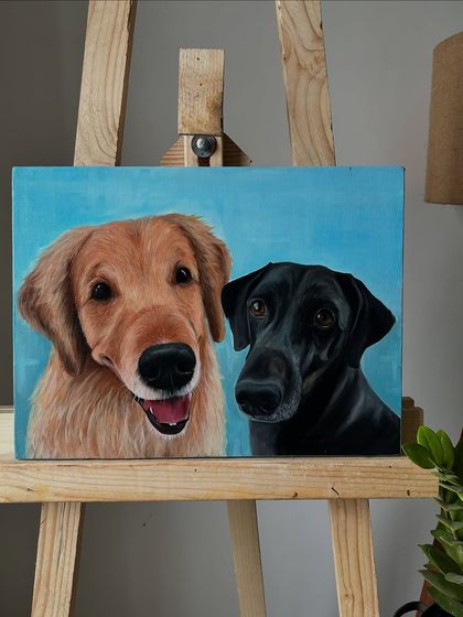 A classic duo, a Golden Retriever and a Black Lab. I focused on capturing their distinct personalities and the beautiful contrast between their coats.