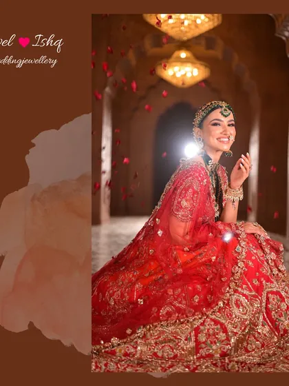A candid, joyful shot of the bride seated, with rose petals showering down. Her smile and sparkling jewellery light up the frame.