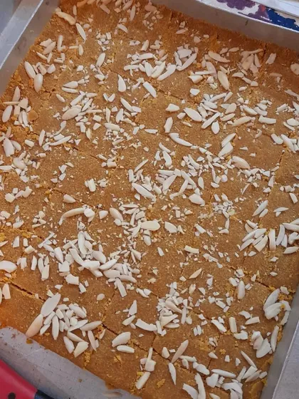 The final tray of Besan Barfi, sprinkled generously with slivered almonds. The aroma of roasted besan and ghee is just heavenly.