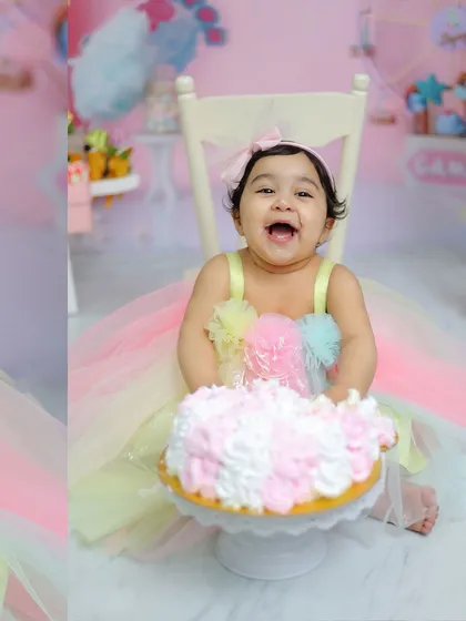 A big, happy smile covered in frosting. Our cake smash sessions are all about letting your child be themselves and celebrating their big milestone.