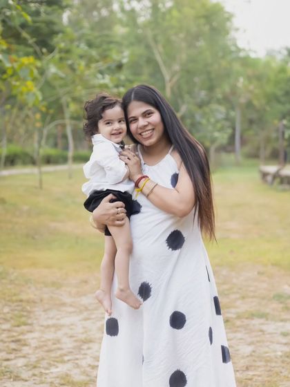 A mother holds her son close in a warm embrace during their outdoor family session.