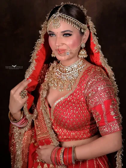 A classic portrait pose, capturing the bride's direct gaze and elegant posture.