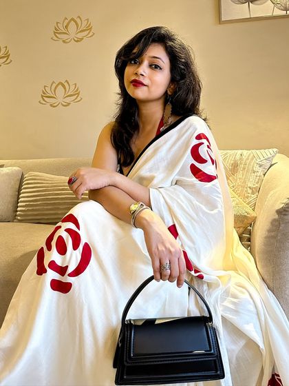 Another angle of the modern saree look, showing how I hold the structured bag to maintain a poised and elegant posture. Every detail counts in personal styling.