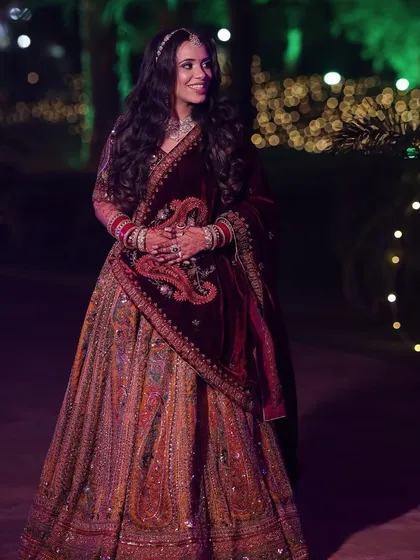Palak's reception look was all about subtle elegance. Her multi-colored lehenga was paired with a soft makeup look and beautiful open waves.