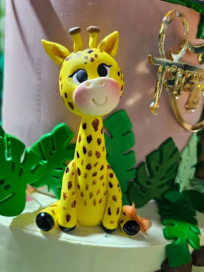 A close-up of the sweet, smiling giraffe figurine.