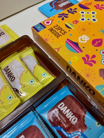 A detailed look inside the 23-piece Danko Festive Delights box, showing the neat arrangement of the assorted chocolates and brownies.