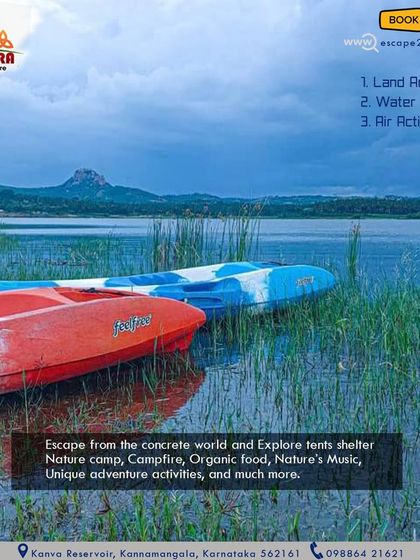 Escape the concrete world. Our kayaks rest by the shore, ready for you to explore the lake with its beautiful mountain backdrop.