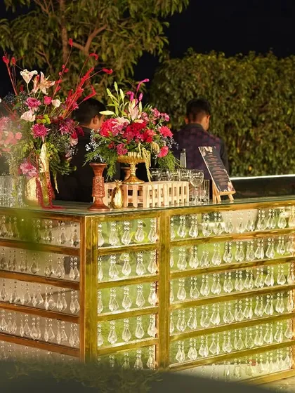 We design bars that become the centerpiece of your celebration. Our custom 'Bling Bar' is a testament to luxury and elegance, decked with hanging crystals and beautiful florals to create a truly glamorous focal point.