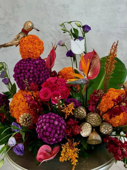For festive celebrations, I blend tradition with a modern twist. This Diwali arrangement combines the auspiciousness of Indian marigolds with exotic anthuriums and gomphrena, creating a vibrant centerpiece that honours heritage with a contemporary feel.