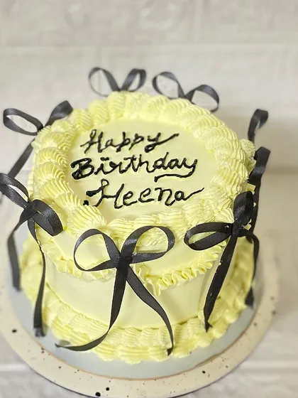 Another angle of our trendy yellow and black bow cake.