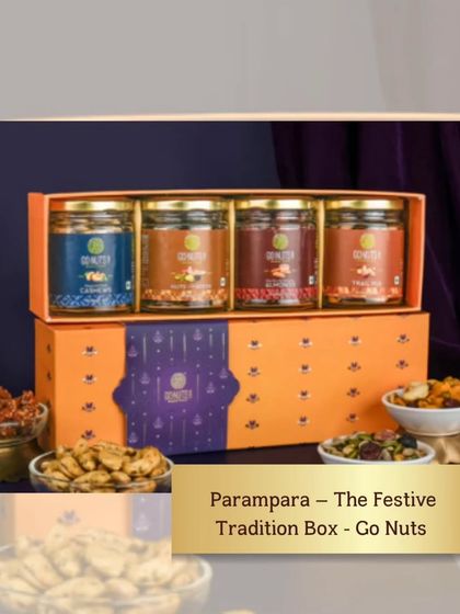 This "Parampara" festive box, filled with an assortment of gourmet nuts, is a perfect wedding gift that feels both traditional and luxurious.