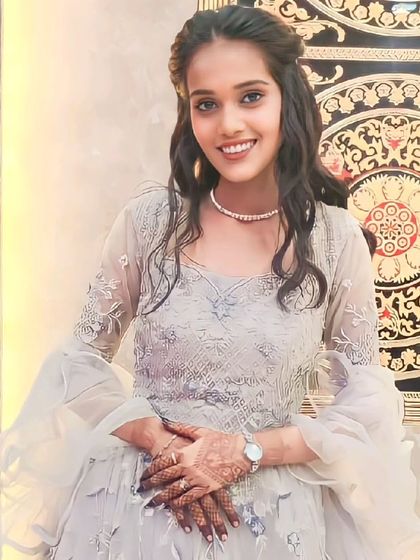 A close-up of our client looking radiant in this grey ruffle lehenga. The soft fabric and delicate embroidery make it a dream to wear.