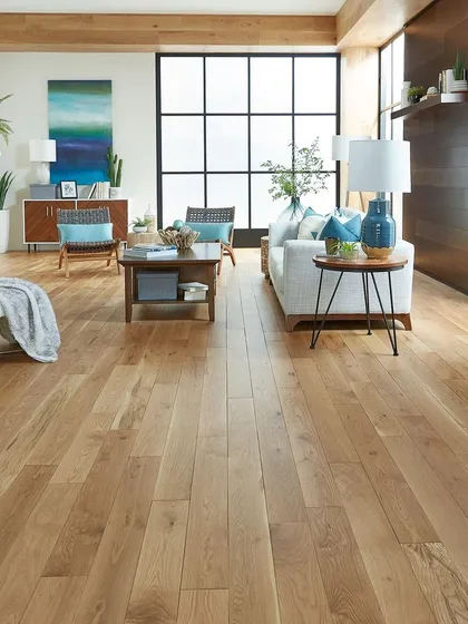 I transformed this living room with wide-plank, light natural wood flooring. The goal was to create a bright, airy space that feels both modern and welcoming. My professional flooring installation ensures a seamless look that enhances natural light.