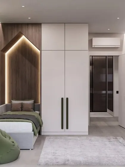 A cozy and modern kid's room with a house-shaped backlit headboard. The green beanbag and natural wood tones create a calming and nature-inspired feel.