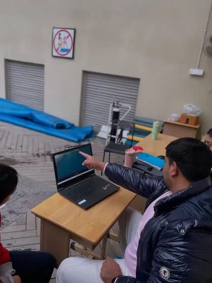 My coaching is built on a foundation of sports science. Here, I am conducting a video analysis session with a swimmer to break down their biomechanics. We measure everything that is measurable to ensure every stroke is efficient and powerful. This is how we avoid "garbage yardage."