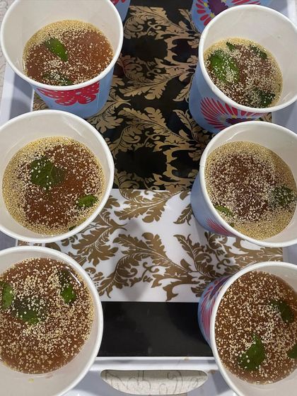 A tray of refreshing Beetroot Kanji ready to be served. It's a traditional, healthy, and delicious way to stay cool during the summer months.