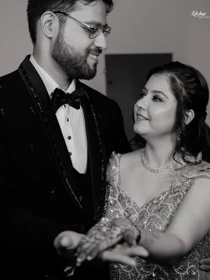 A classic black and white photo of the couple sharing a dance. This timeless style emphasizes their expressions and the romance of the moment.
