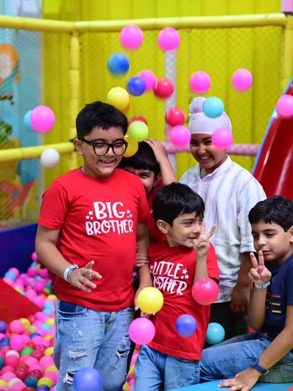 Friends having a blast in the ball pit. It's a fantastic sensory experience and a place for endless giggles.