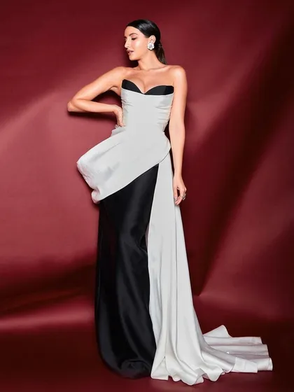 I styled Nora Fatehi in this elegant black and white sculpted gown by Mark Bumgarner. The look is a study in contrasts, combining a classic color palette with a modern, architectural silhouette for a sophisticated awards night appearance.