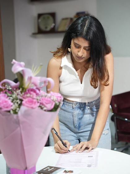 Signing the contract. A moment of focus and commitment to my dreams.