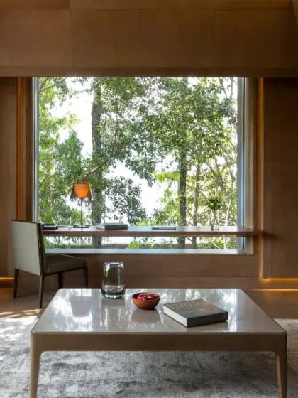 The private study area in our Junior Suite overlooks the lush green landscape. It is a quiet corner to read or reflect, with abundant natural light.