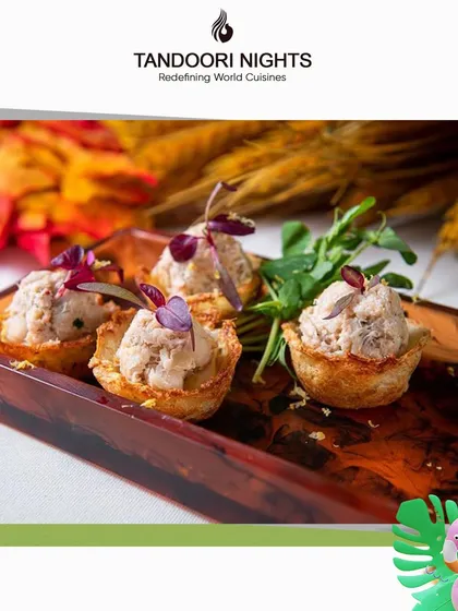 Beat the heat with our cool summer bites. These savory tartlets are filled with a light, creamy mousse and served in crisp pastry shells, offering a taste of paradise for your event.
