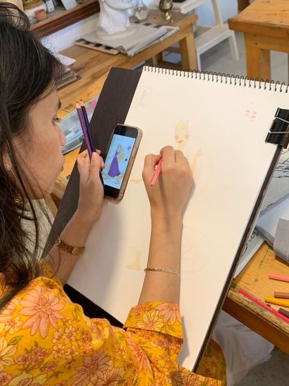 A student works on a character drawing with colored pencils. Our hobby classes allow you to explore any medium you choose, with personalized guidance to help you along the way.