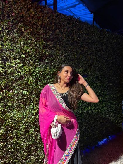 This client paired a black top with a bright pink embroidered dupatta for her Navratri look. Simple, yet so effective.