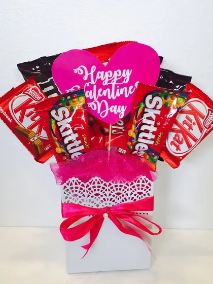For the one with a sweet tooth, a simple and cute Valentine's bouquet made entirely of KitKats and Skittles.