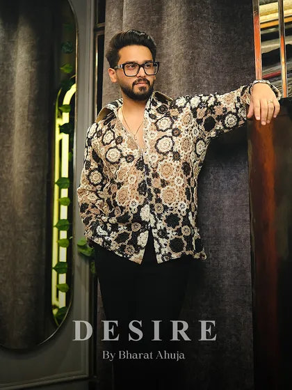 A full-length shot of the crochet-style shirt, a piece that turns heads effortlessly with its unique texture and design.