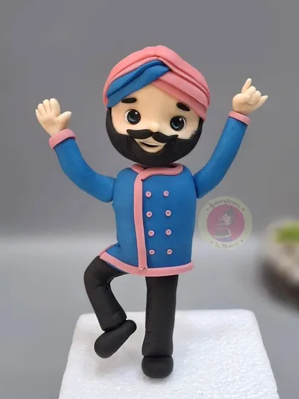 A close-up of the dancing Chef Harpal Singh Sokhi figurine. Capturing his energy and signature style was so much fun.