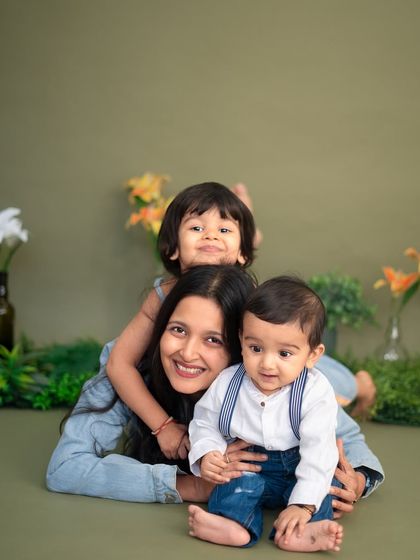 A mother piled under her two adorable boys during our Mother's Day mini-sessions. This playful photo perfectly captures the fun and love of motherhood.