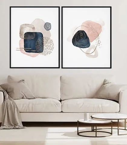 This set of two framed prints showcases abstract geometric patterns in a stylish and modern design. The combination of navy, pink, and beige creates a chic and contemporary look.