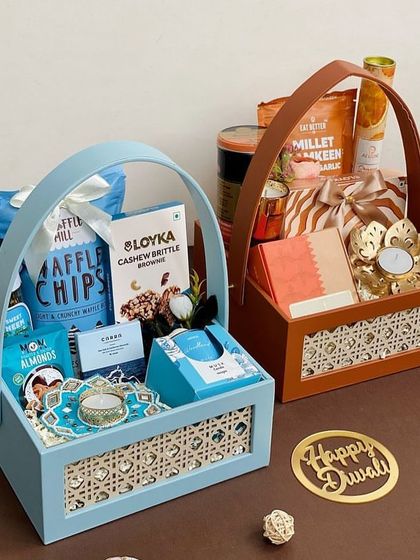 Our Rattan Collection for Diwali. These elegant woven baskets come in beautiful pastel blue and tan, filled with gourmet snacks and festive decor.